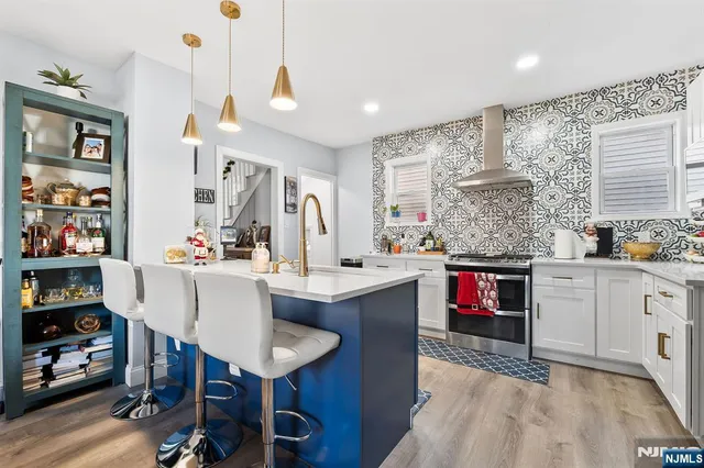 a kitchen with a stove and cabinets