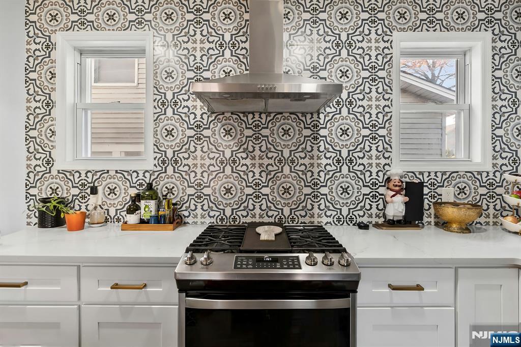 71 Spring Street Nutley, NJ 07110 - Photo 20 of 50 a kitchen with a stove and cabinets