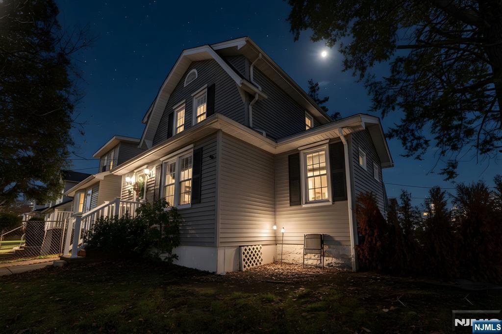 71 Spring Street Nutley, NJ 07110 - Photo 2 of 50 a front view of a house with a yard