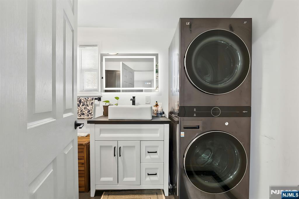71 Spring Street Nutley, NJ 07110 - Photo 23 of 50 a utility room with sink dryer and washer