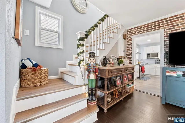 a view of entryway with wooden floor