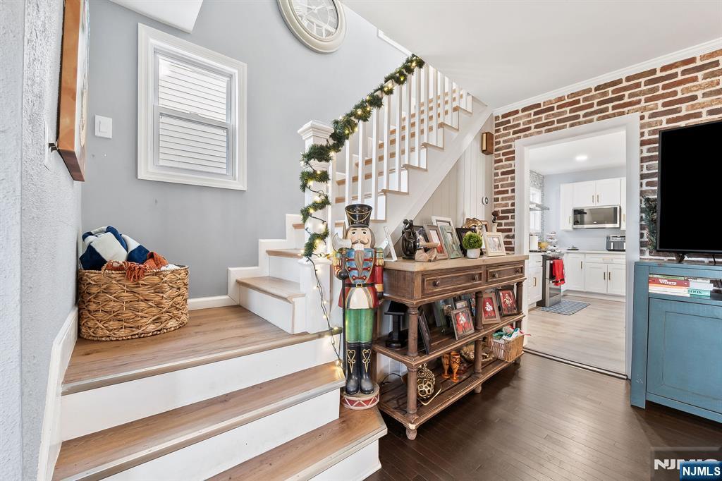 71 Spring Street Nutley, NJ 07110 - Photo 26 of 50 a living room with furniture and flat screen tv