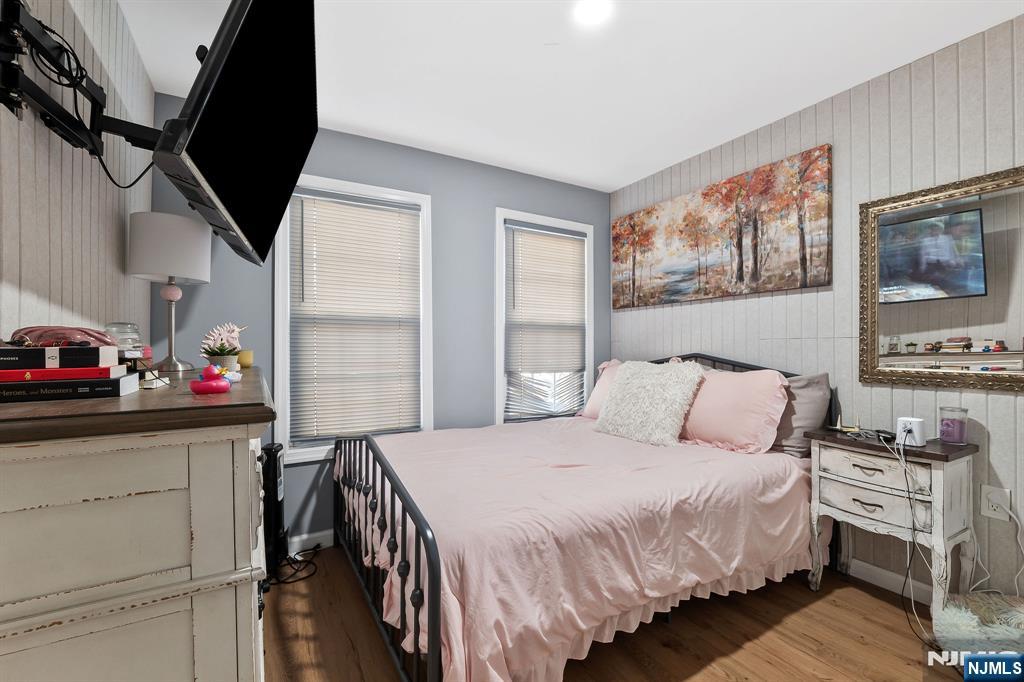 71 Spring Street Nutley, NJ 07110 - Photo 29 of 50 a bedroom with a bed closet and flat tv screen