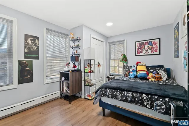 a bed room with a bed and a book shelf
