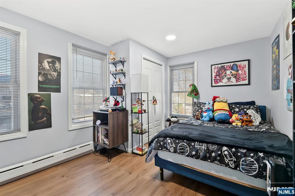 71 Spring Street Nutley, NJ 07110 - Photo 31 of 50 a bedroom with furniture and a window