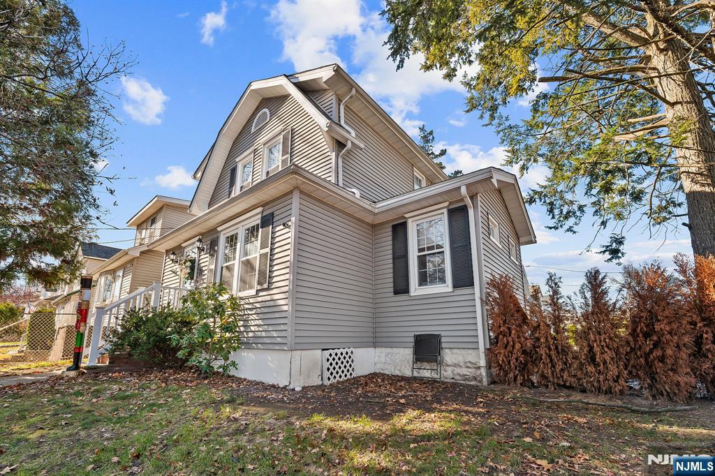 71 Spring Street Nutley, NJ 07110 - Photo 39 of 50 a view of a house with a yard