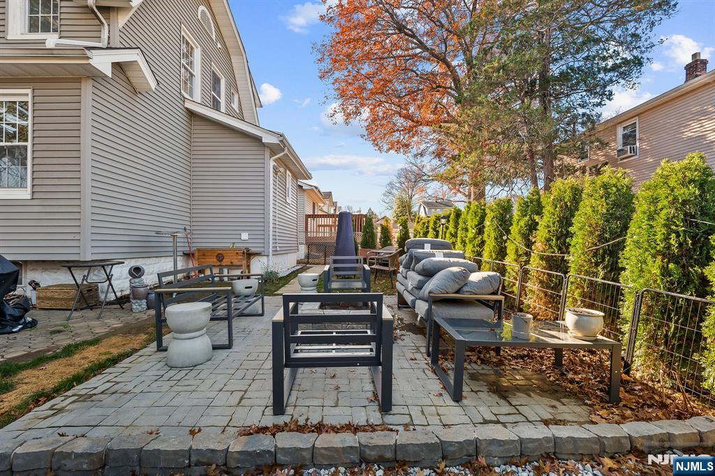 71 Spring Street Nutley, NJ 07110 - Photo 40 of 50 a view of a patio with iron fence