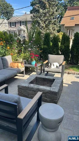 a backyard of a house with outdoor seating