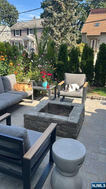 71 Spring Street Nutley, NJ 07110 - Photo 44 of 50 a view of outdoor sitting area with furniture and wooden fence