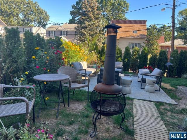 71 Spring Street Nutley, NJ 07110 - Photo 50 of 50 a backyard of a house with outdoor seating