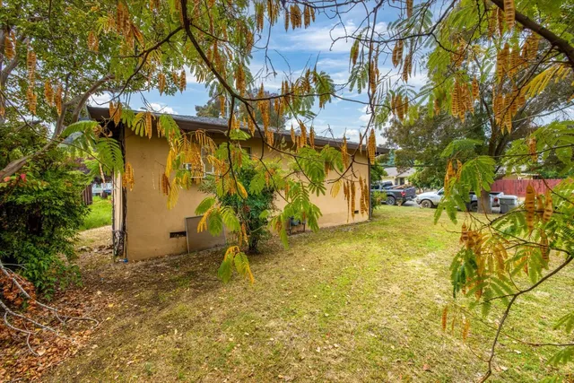 a view of a yard with an outdoor space