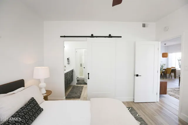 a bathroom with double vanity sink and a mirror