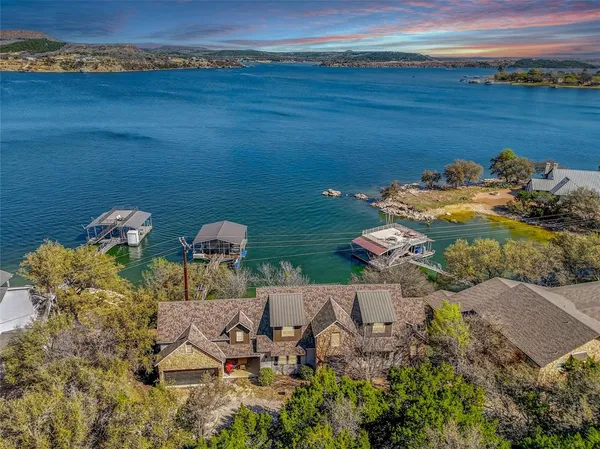 an aerial view of a house with outdoor space