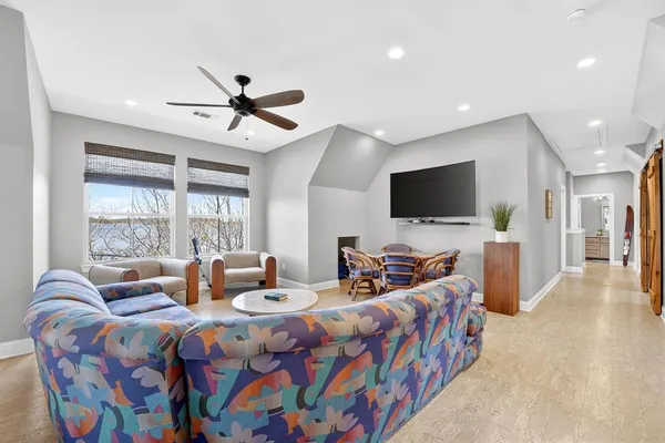 a bedroom with furniture and a flat screen tv