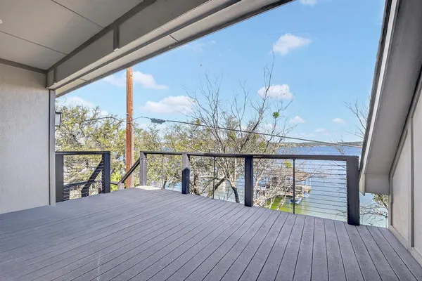 a view of a balcony with wooden floor