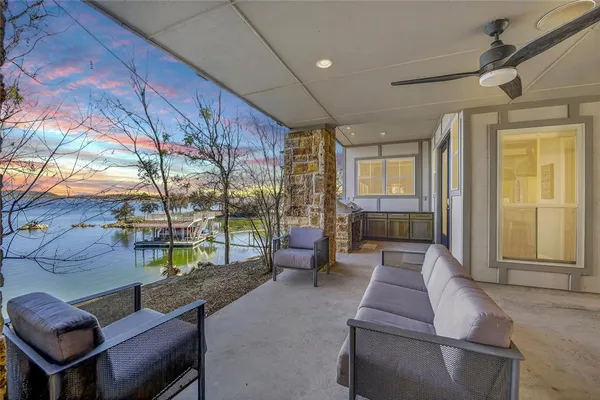 a lobby with furniture and floor to ceiling window