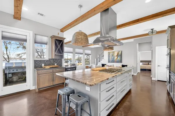 a kitchen with a stove a sink and a refrigerator