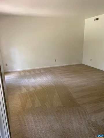 a view of a room with an empty space