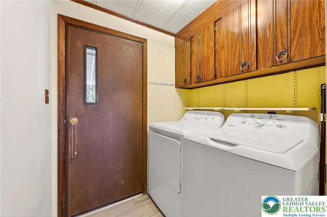 a utility room with dryer and washer