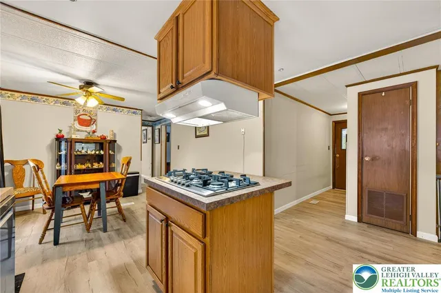 a kitchen that has a table and chairs in it