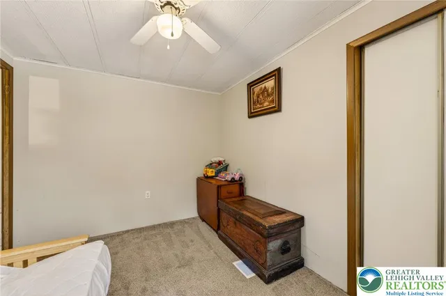 a bathroom with a sink a toilet and shower curtain