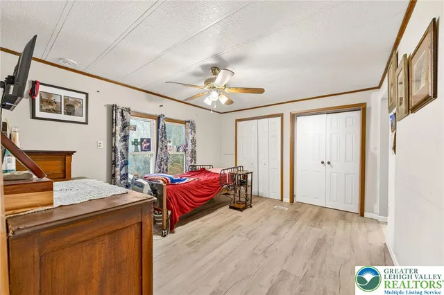 a bedroom with furniture and window