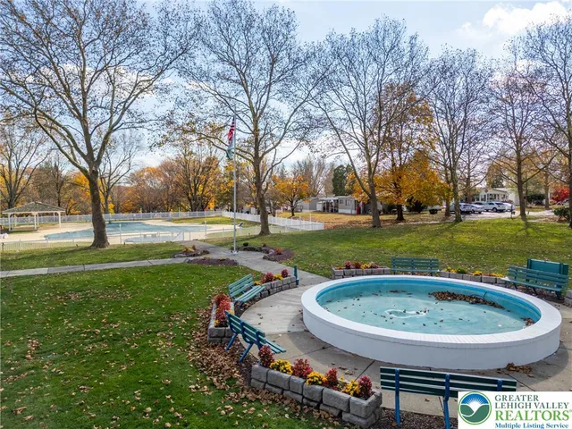 an aerial view of a house with a big yard