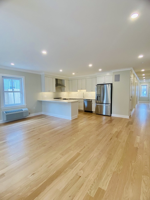 15 Yuill Circle, Unit 2 Boston, MA 02136 - Photo 1 of 16 a view of empty room with wooden floor and windows