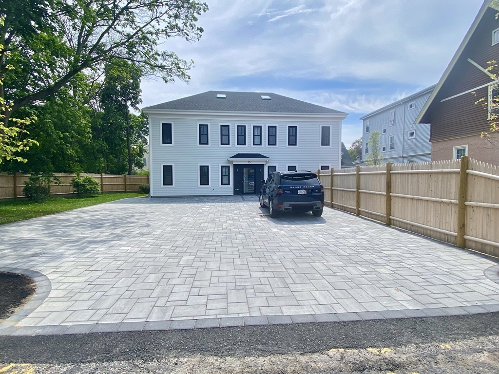 15 Yuill Circle, Unit 2 Boston, MA 02136 - Photo 16 of 16 a view of a house with a yard and sitting area
