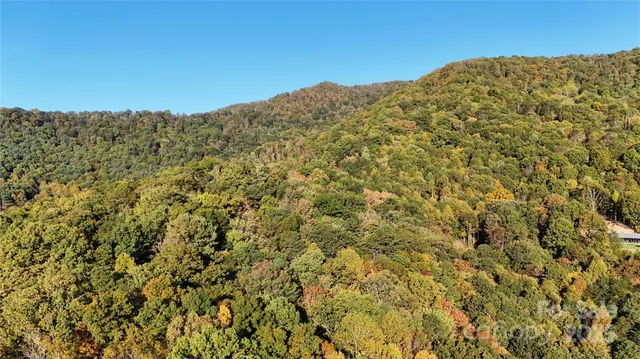 a view of a large mountain with a mountain in the background
