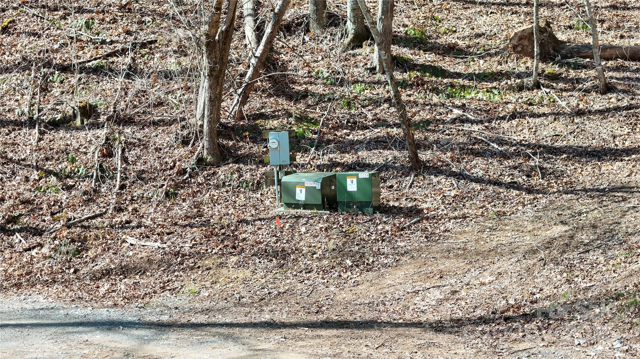 2 Roberts Mountain Road, Unit 2 Clyde, NC 28721 - Photo 10 of 28 a room with a bench and trees