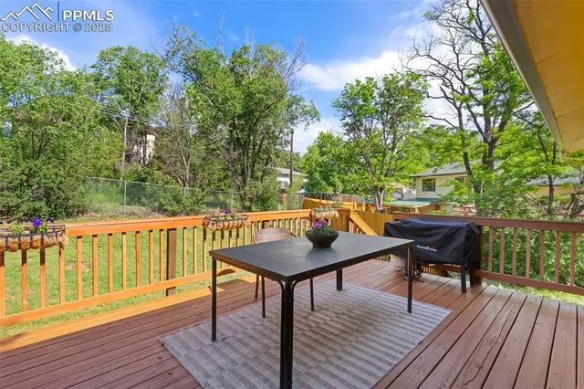 a backyard view with a seating space