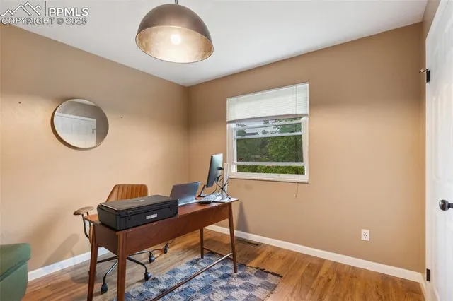 a workspace with furniture and a window