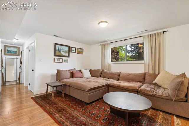a living room with furniture and a window