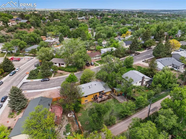 an aerial view of a city with lots of residential buildings