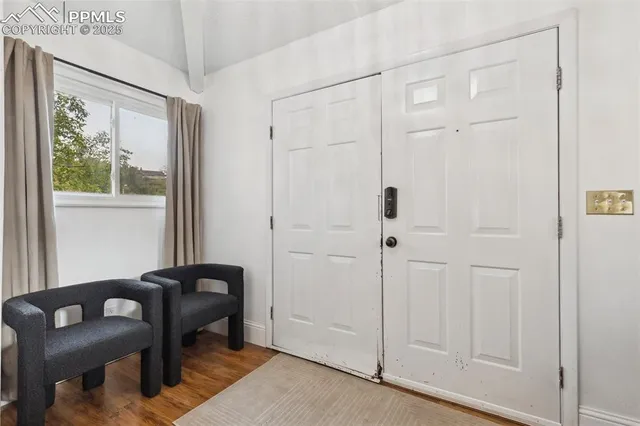 a view of a livingroom with furniture and a window