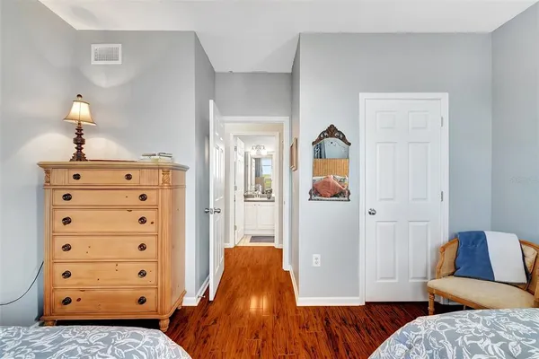 a bedroom with a bed and a dresser