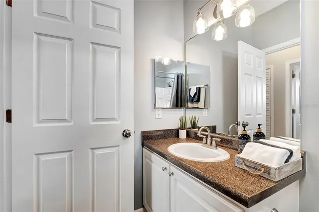 a bathroom with sinks granite and a sink
