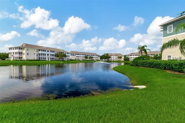 a view of a lake with houses in the background
