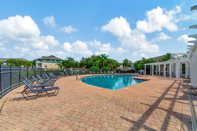 a view of a swimming pool with lounge chair