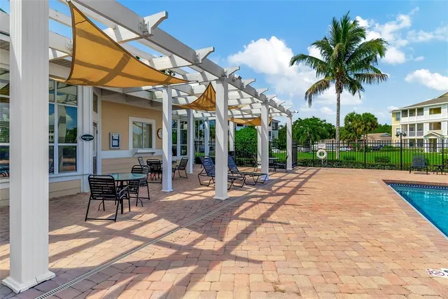 a view of a patio with a table and chairs