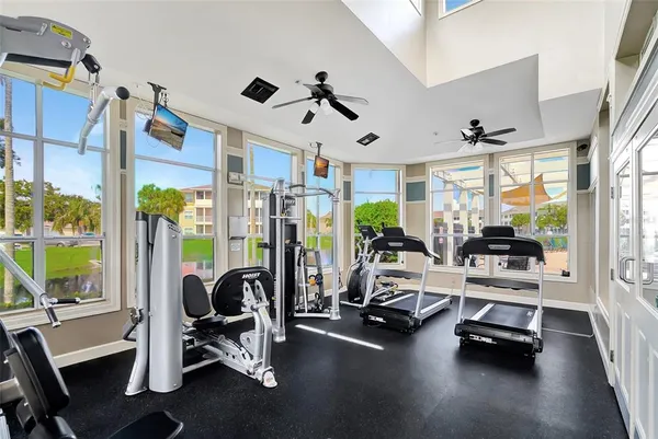 a view of a livingroom with gym equipment