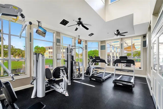 a view of a livingroom with gym equipment