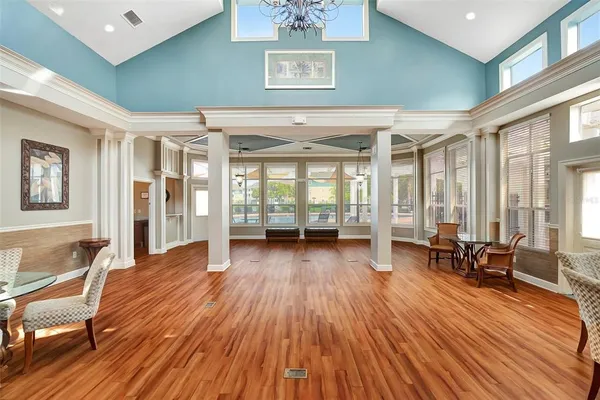 a view of livingroom with furniture wooden floor and windows