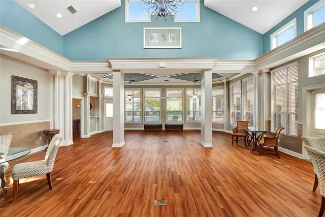 a view of livingroom with furniture wooden floor and windows