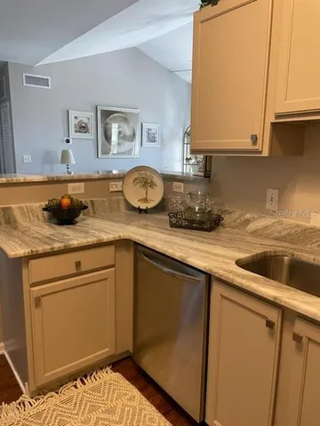 a kitchen with a sink and cabinets