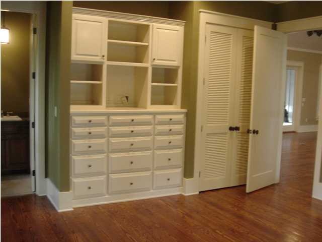 134 Grayton Trail Road Santa Rosa Beach, FL 32459 - Photo 8 of 21 a view of an empty room with wooden floor and closet