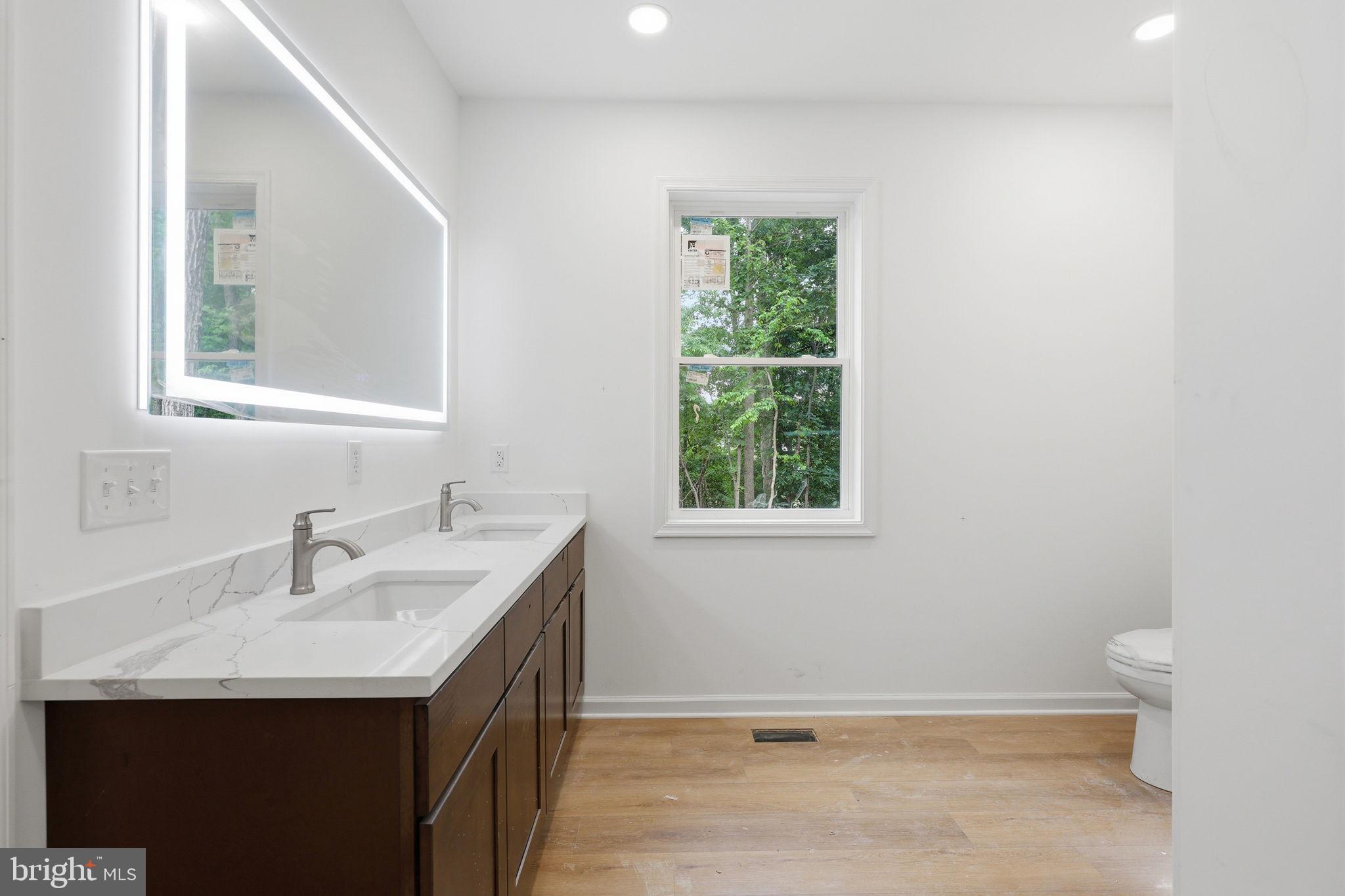 10339 Back Creek Valley Road Hedgesville, WV 25427 - Photo 23 of 48 a bathroom with a sink and a window