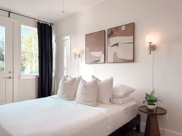 a bedroom with a bed and a table