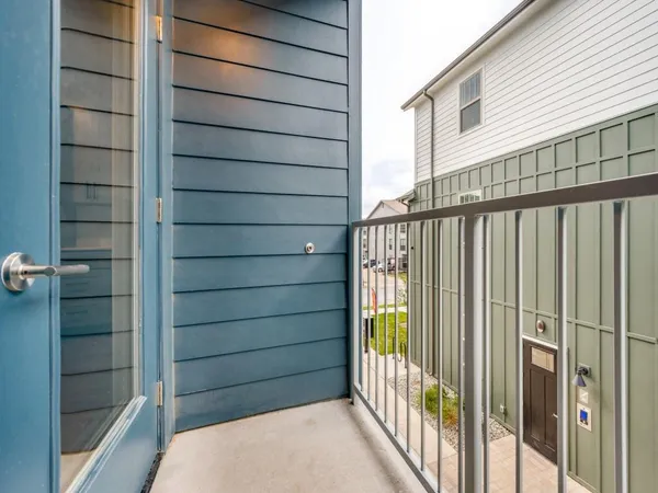 a view of a porch with wooden floor